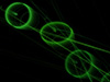 #2000410 - Green circles and lines on black background